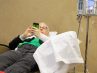A patient relaxes while undergoing dual chemotherapy treatment for advanced ovarian cancer at Ohio State`s James Cancer Hospital and Solove Research Institute. Giving patients like Lavelle chemo through an IV, followed by a dose directly into the abdomen, has been shown to increase three year survival rates. However, a new study has found that fewer than half of women at six major academic medical centers who are eligible for the therapy are actually receiving it. Details: bit.ly/1IeIA5v